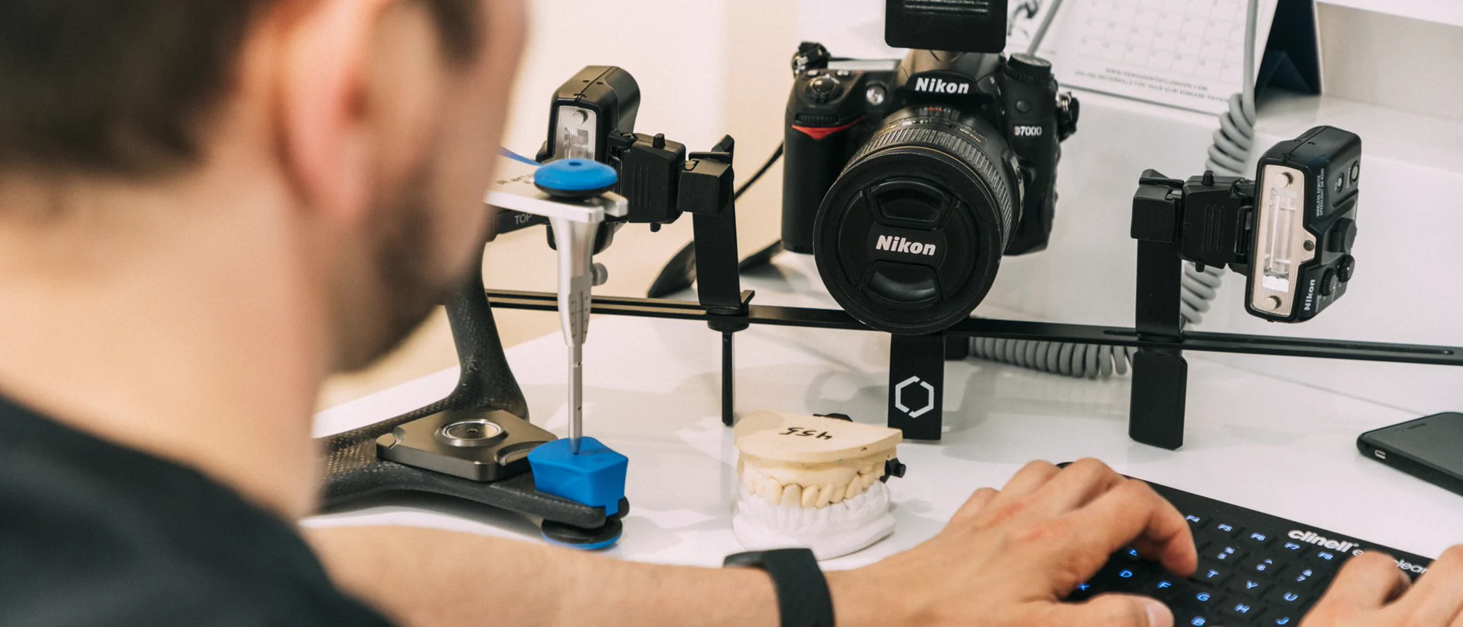 Dental photography equipment and a model are prepared for clinical case documentation.