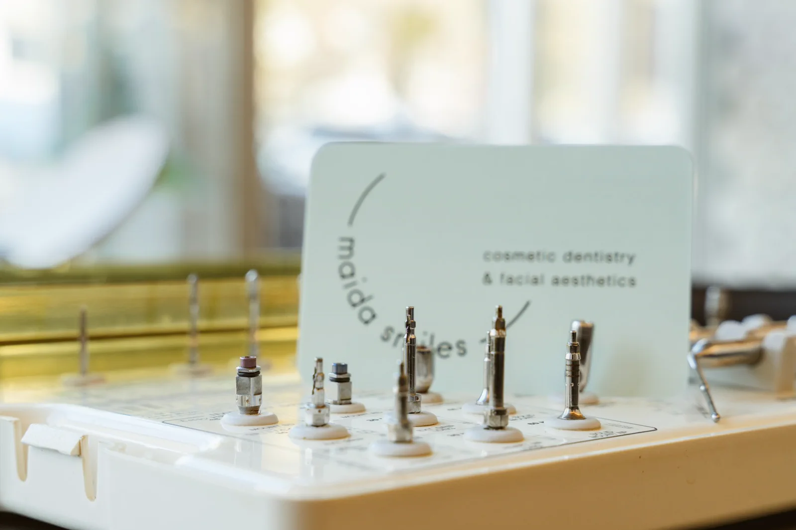 A surgical drill tray holds precisely organised implant instruments.